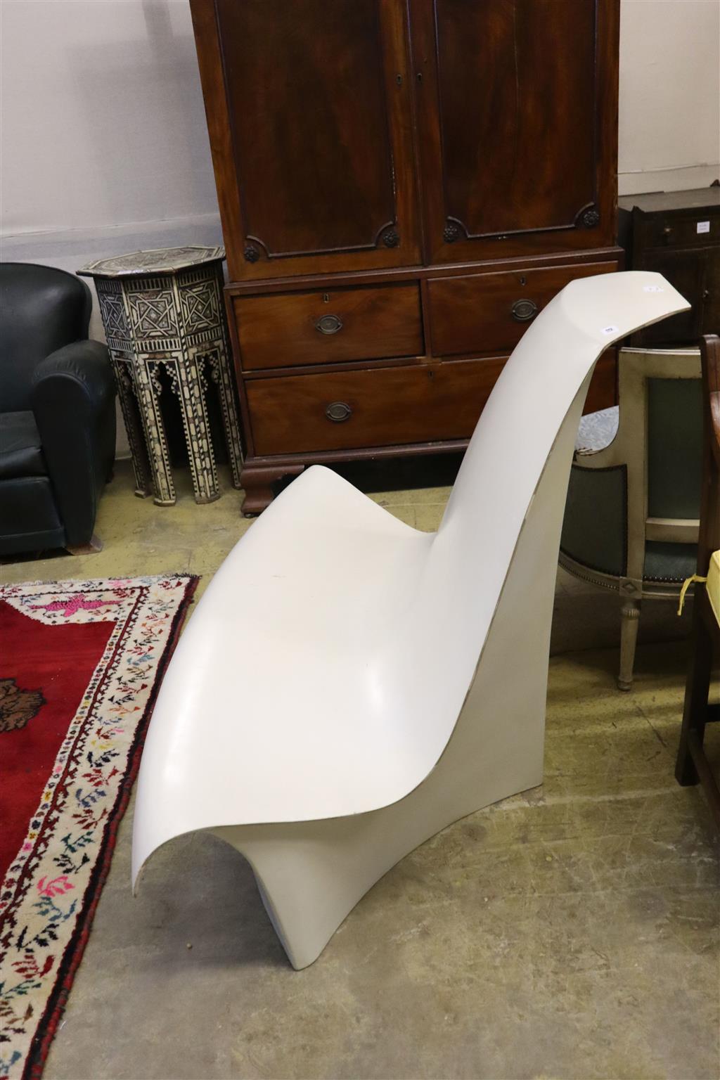 A 1960s white plastic chair